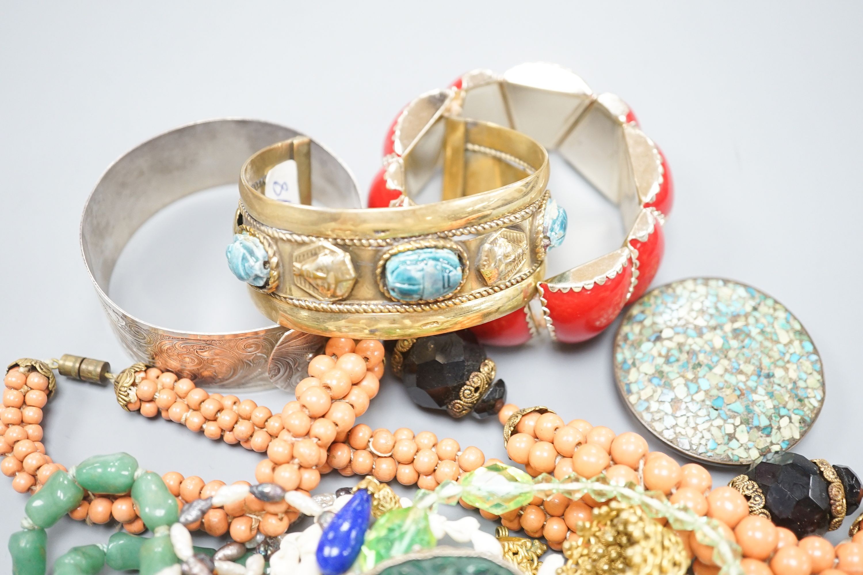 A gilt metal bangle and ring and mixed costume jewellery.